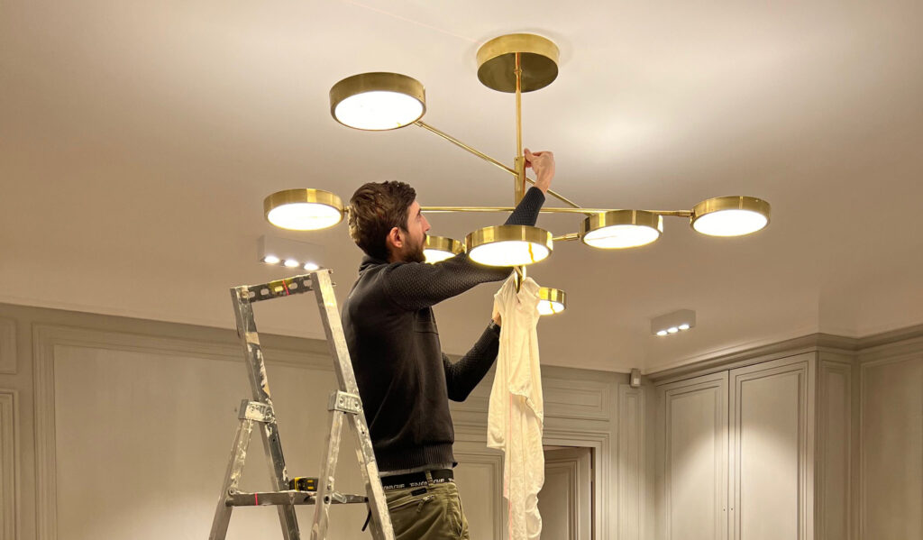 Our Sistema Solare Chandelier Shines Alongside Rare Max Ingrand Sconces